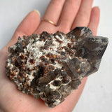 Natural garnet and smoky quartz mineral association