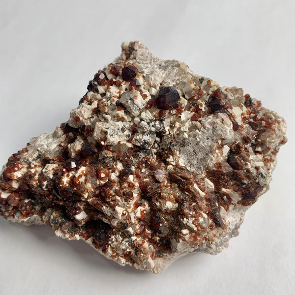 Deep red garnet mineral specimen collector display