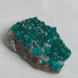 tsumeb namibia dioptase crystals covering rock matrix
