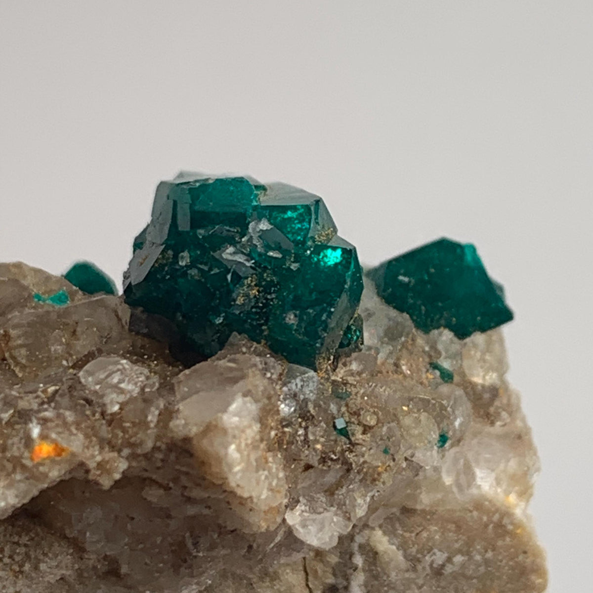 rare emerald dioptase crystals on host rock