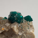 rare emerald dioptase crystals on host rock