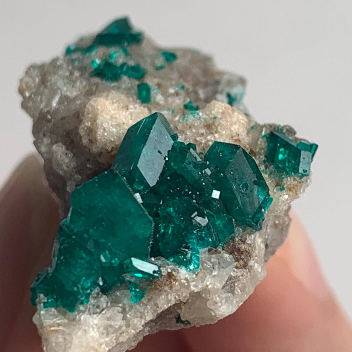 rich emerald green dioptase crystals on matrix