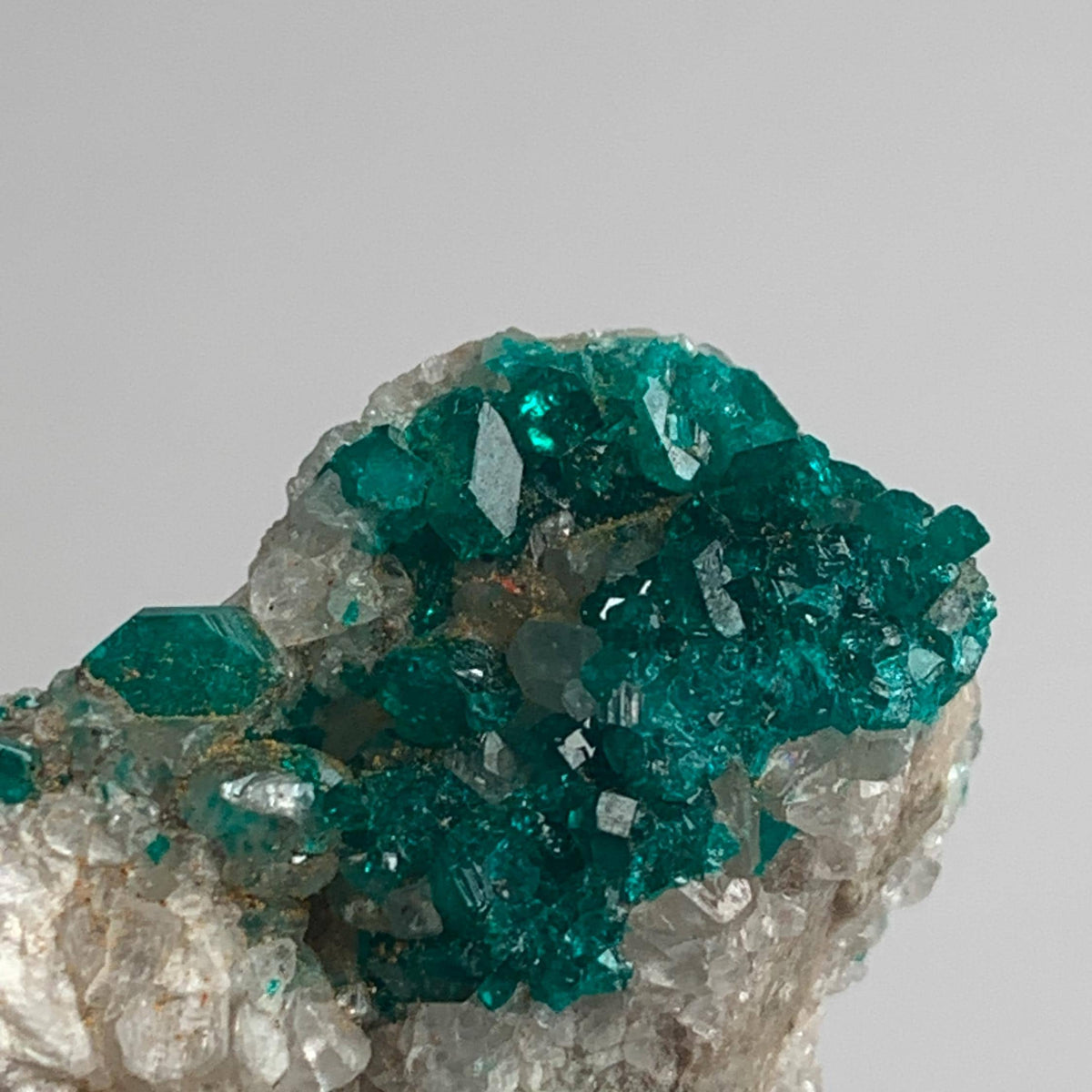 small cabinet dioptase specimen emerald green
