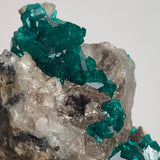 rich emerald green dioptase crystals on matrix