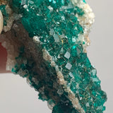 natural dioptase crystals coating matrix surface