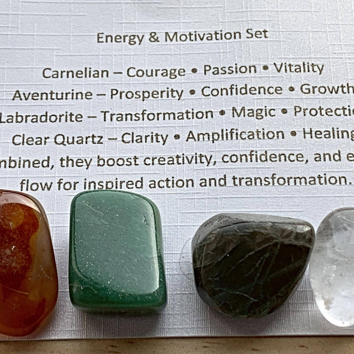 Energy and passion crystal sets displayed inside open cardboard gift boxes with properties cards