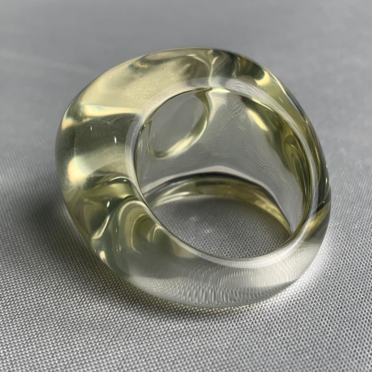 Artistic sculptural gemstone ring featuring clear yellow quartz