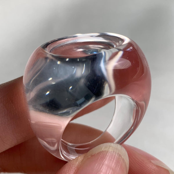 Wide band clear quartz ring with polished transparent finish