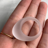 Soft matte clear quartz ring carved from a single stone