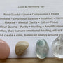 Themed healing crystal sets displayed inside open cardboard gift boxes with properties cards