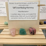 pink rose quartz and green aventurine stone over a self love affirmation card