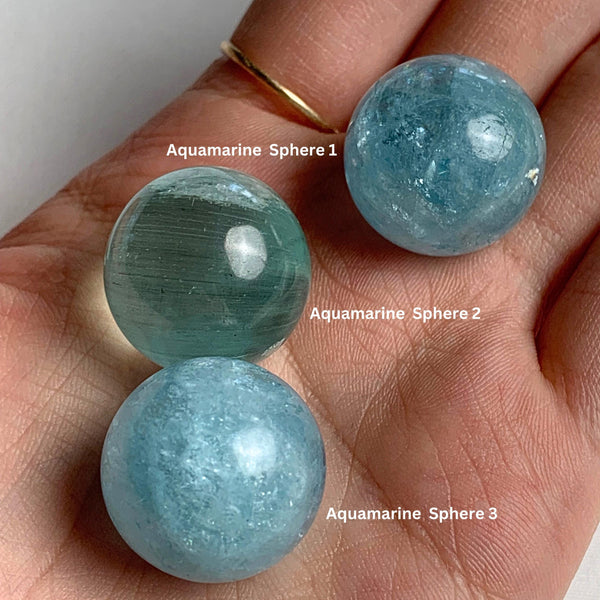 Smooth polished 20mm aquamarine sphere with rich blue saturation