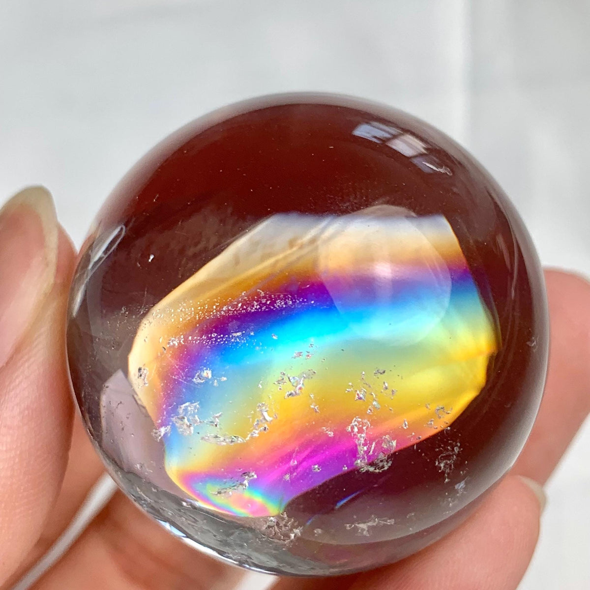 High clarity rainbow quartz crystal ball measuring 38mm diameter