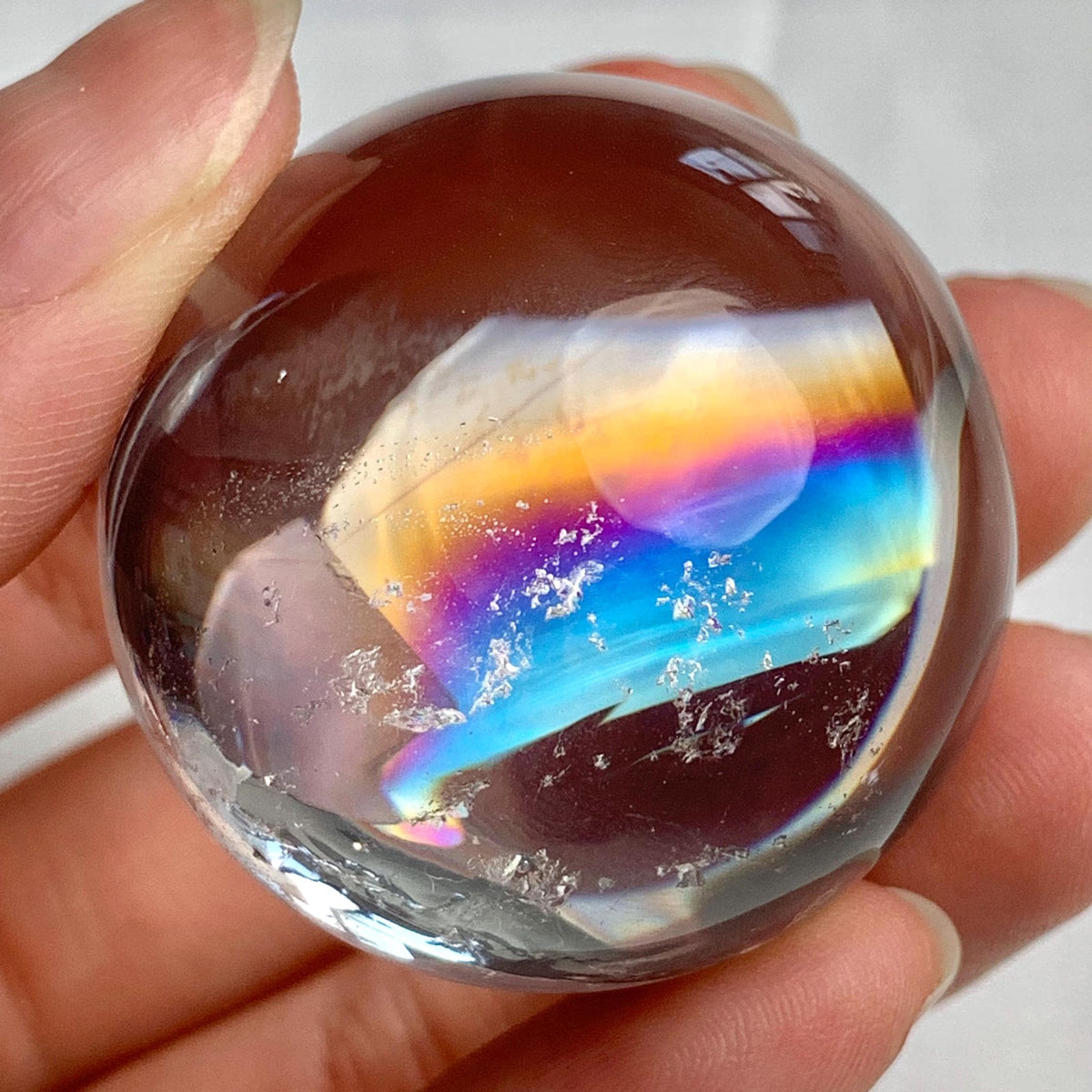 Rare rainbow quartz sphere with exceptional rainbow inclusions and clarity