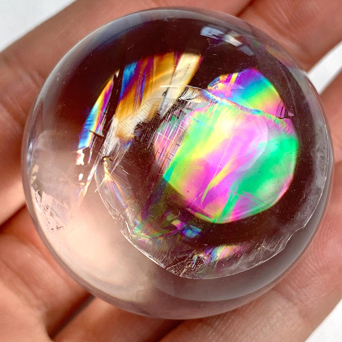 Natural rainbow quartz crystal ball ideal for collectors and meditation use