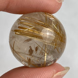 Premium rutilated quartz crystal sphere weighing 13 grams