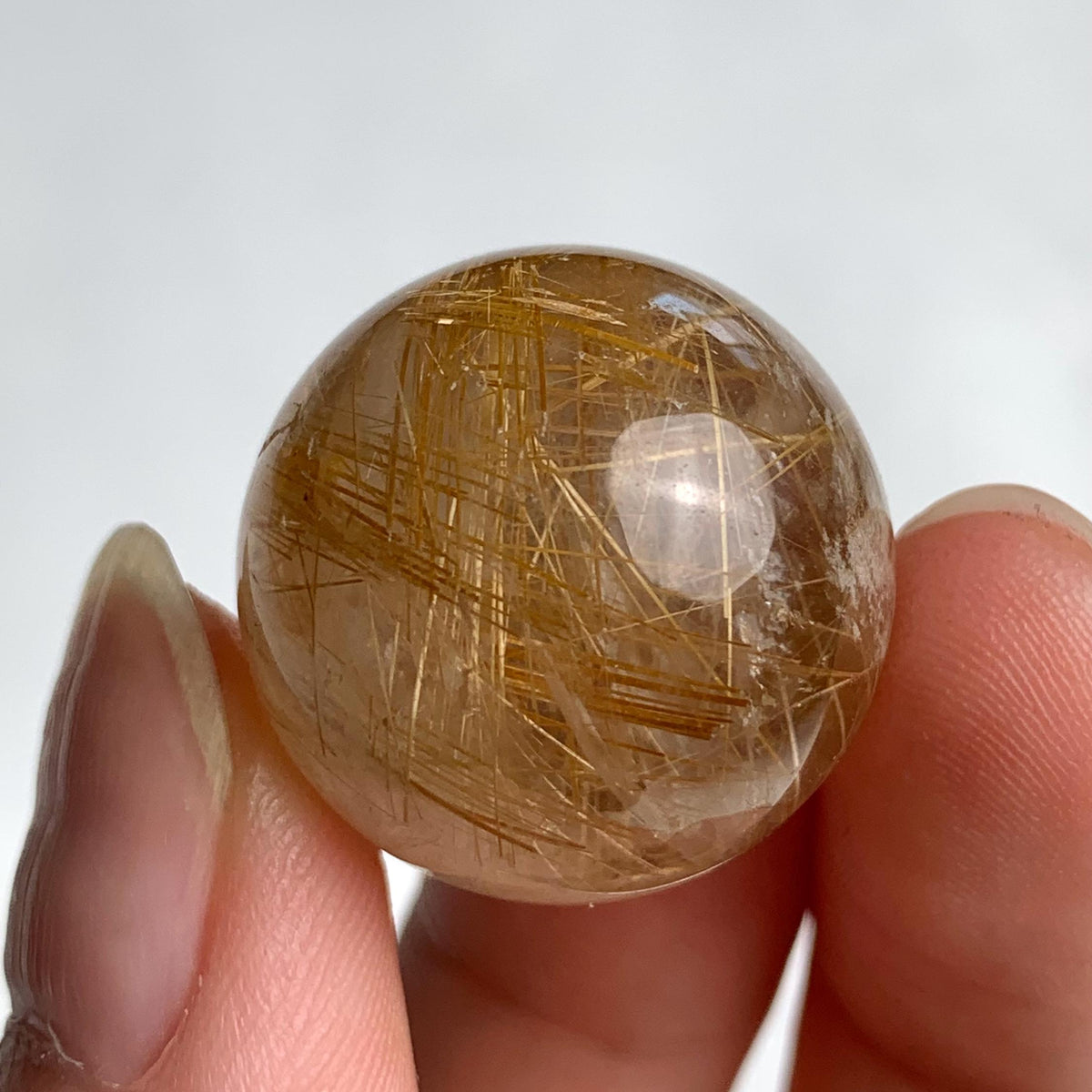 21mm polished quartz crystal ball with natural golden needle inclusions