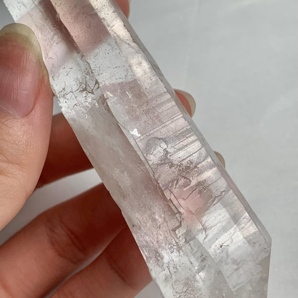 Side view of long double terminated Lemurian seed  crystal Quartz