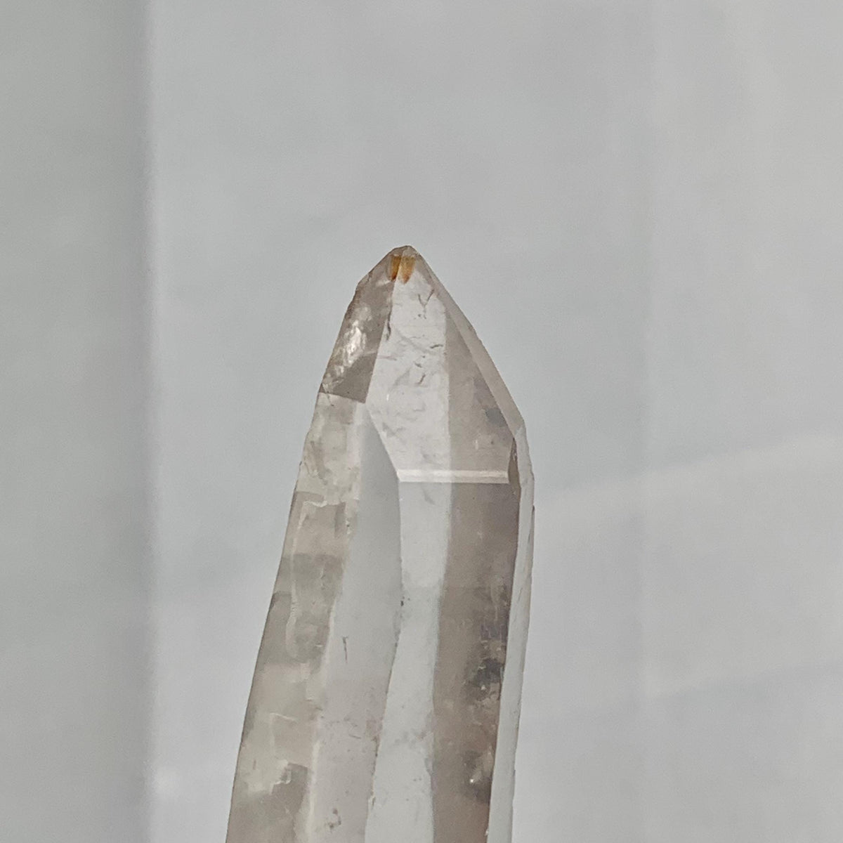Close up of Isis face formation on a high clarity Lemurian quartz crystal