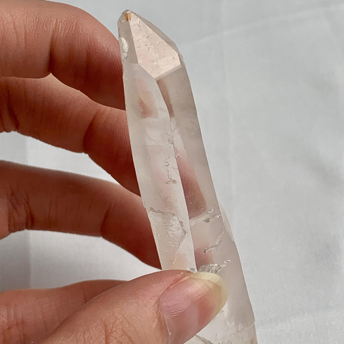 Clear quartz collector specimen measuring 91mm in length