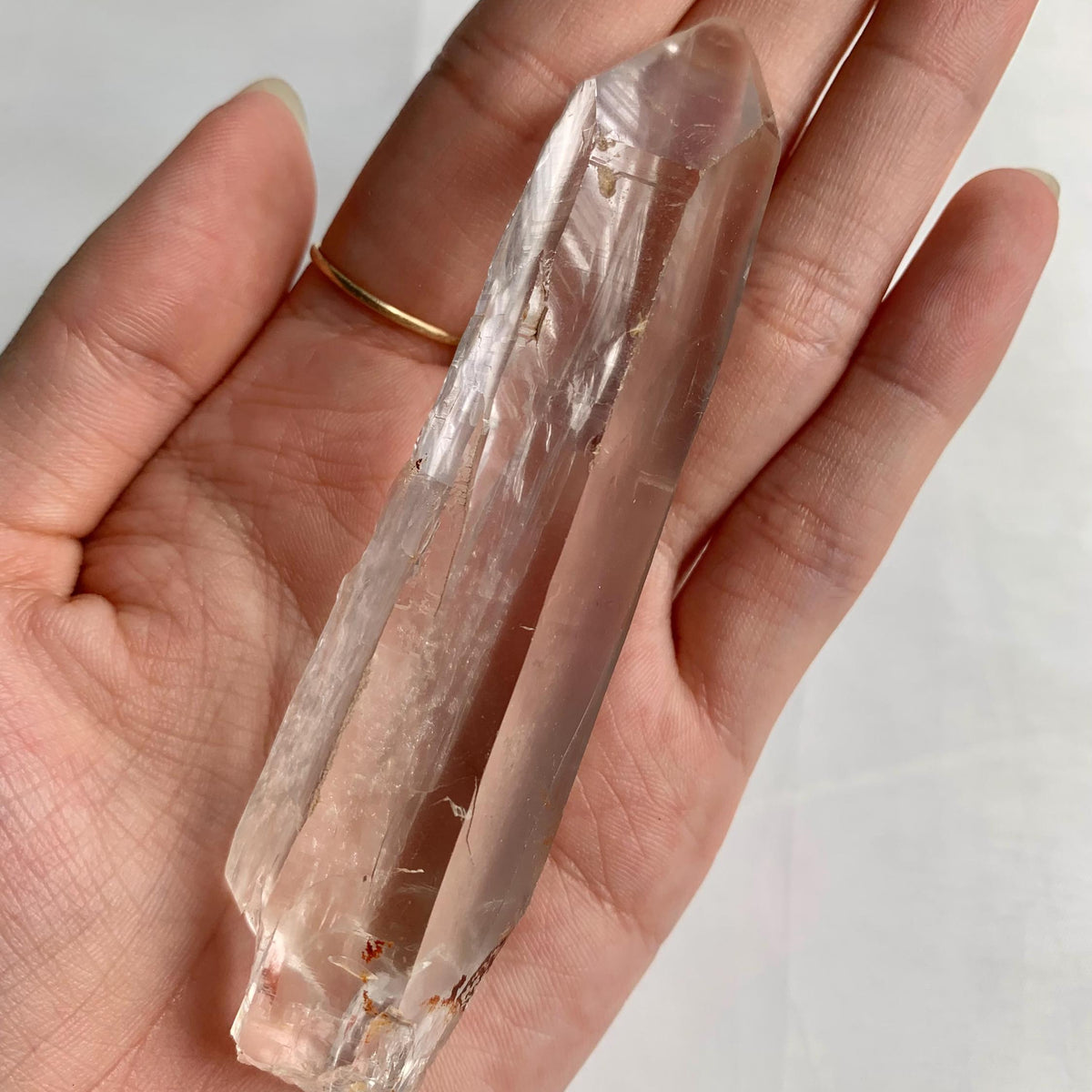 Natural crystal with etched growth lines and high clarity