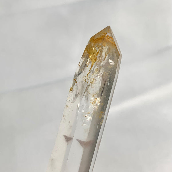 Close up of golden tones inside clear quartz crystal