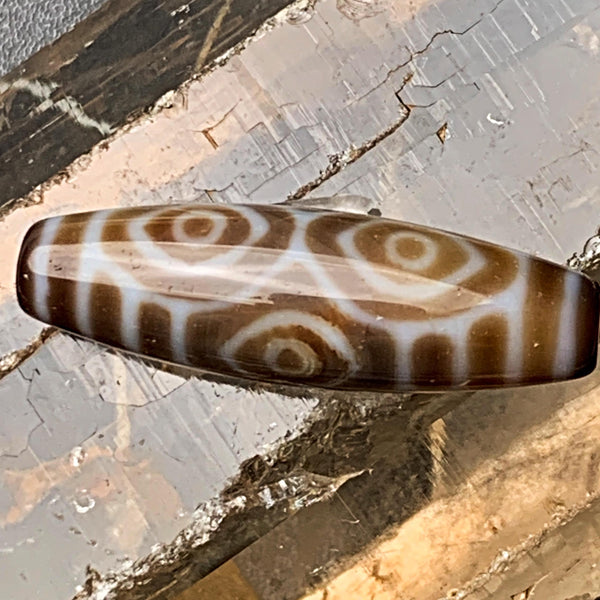 Rare Tibetan dragon eye dzi bead with sharp black and white circular patterns