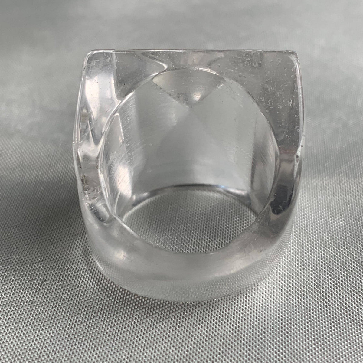 Wide band statement ring showcasing a large pyramid crystal design