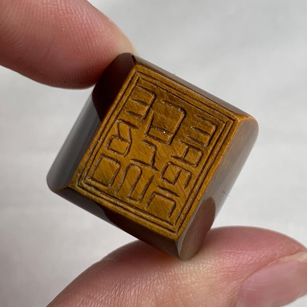 Wide band tiger eye ring hand carved from solid stone