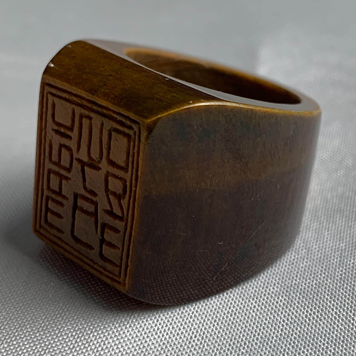 Large square tiger eye ring carved from a single piece of stone