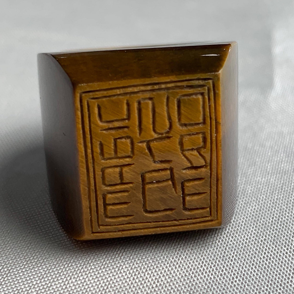 Tiger eye statement ring with engraved square table design