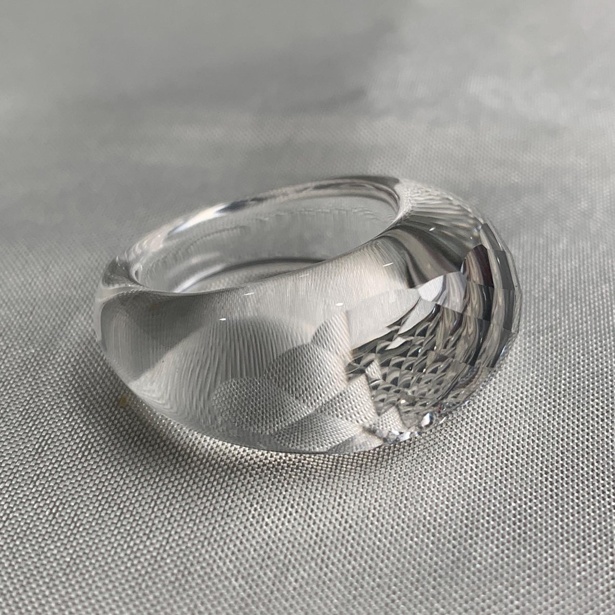 Bold clear quartz ring carved from a single crystal stone