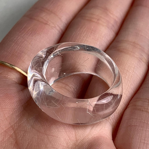 Handmade quartz ring with visible rutile strands inside crystal