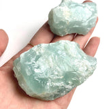 Raw aquamarine crystal specimen with natural blue color and rough texture