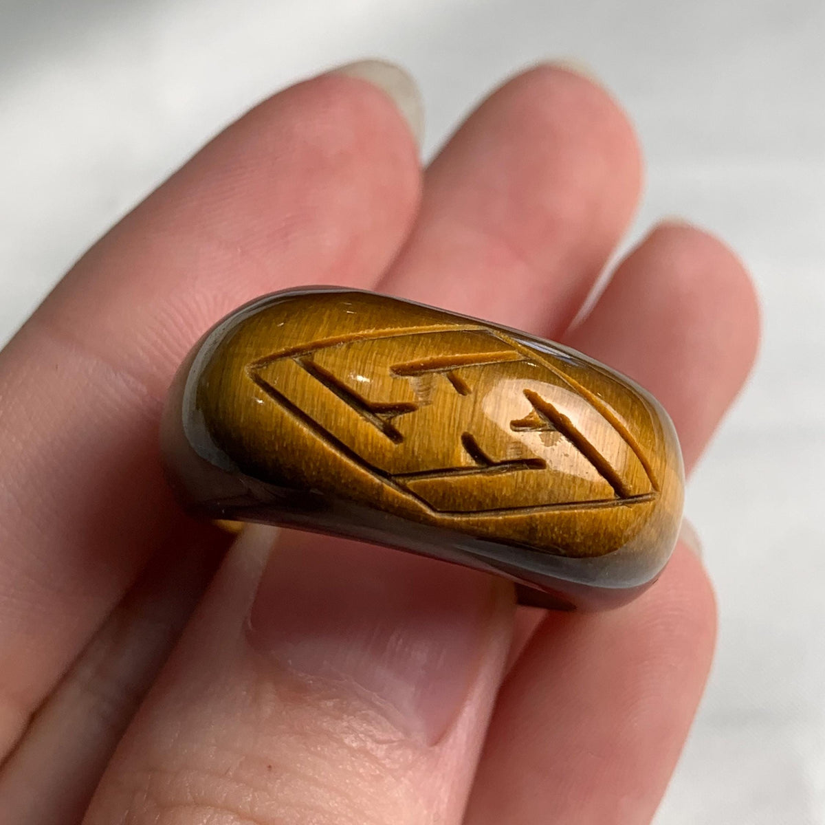 Unique tiger eye gemstone ring showcasing natural striped patterns