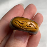 Unique tiger eye gemstone ring showcasing natural striped patterns
