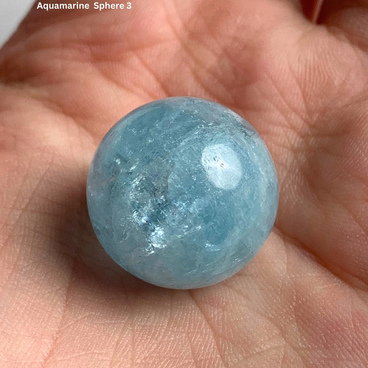 Deep blue aquamarine sphere 20mm displaying rich ocean color
