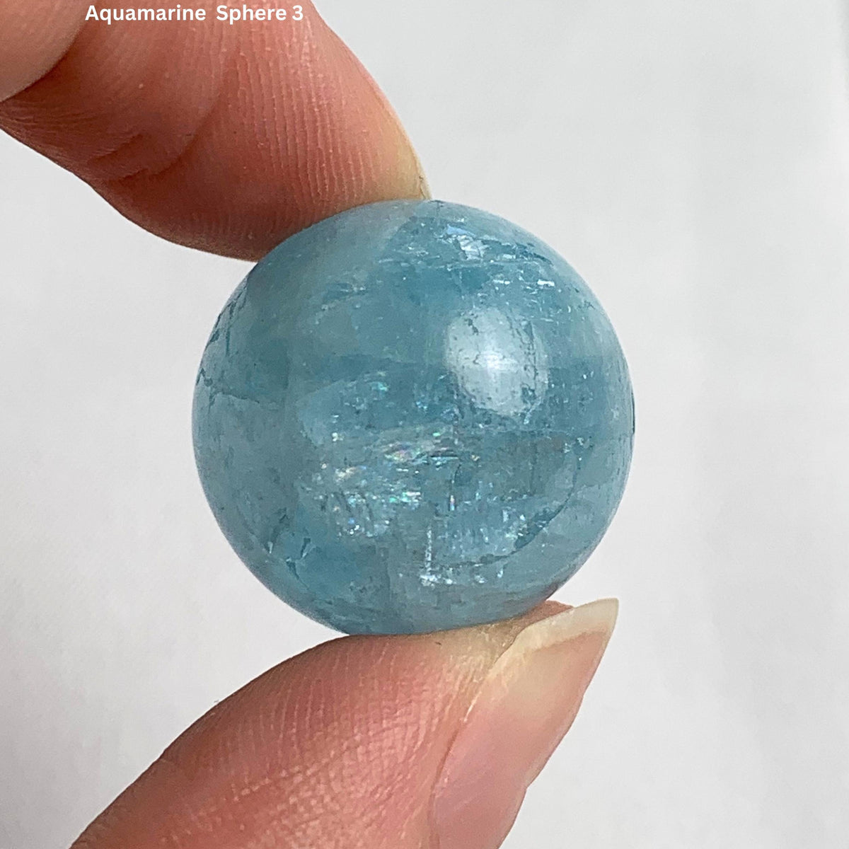 Deep blue aquamarine sphere 20mm displaying rich ocean color