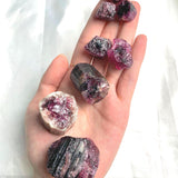 Collection of genuine pink tourmaline stones available in multiple size categories