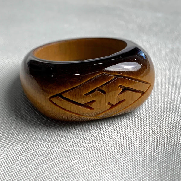 Natural tiger eye crystal ring featuring carved engraved details