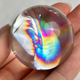 Polished rainbow quartz crystal ball measuring 37mm diameter