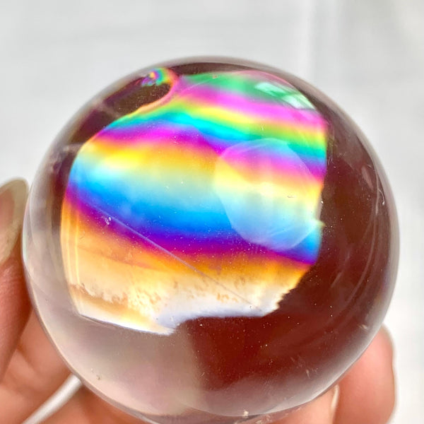 Collector quality rainbow quartz sphere weighing approximately 76 grams