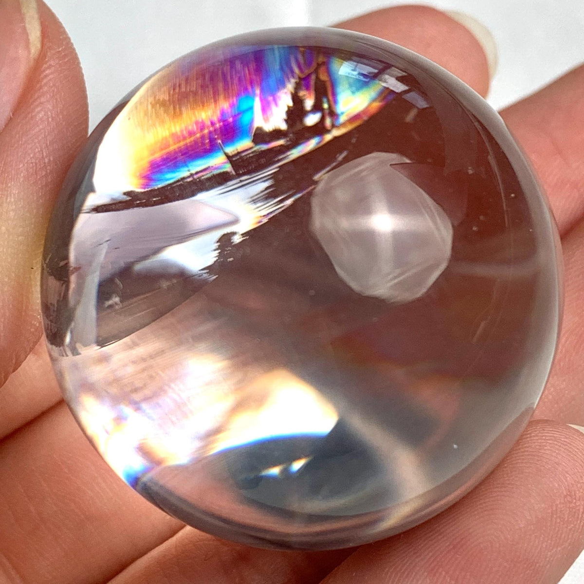 36mm high clarity quartz crystal sphere with subtle rainbow reflections