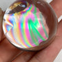Polished rainbow quartz sphere ideal for crystal collectors and display