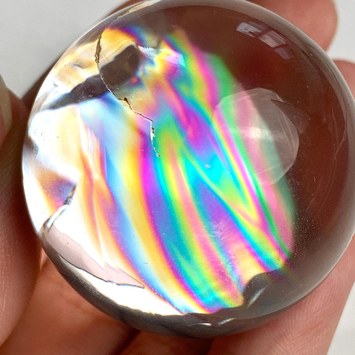 Collector quality rainbow quartz crystal sphere weighing 77 grams