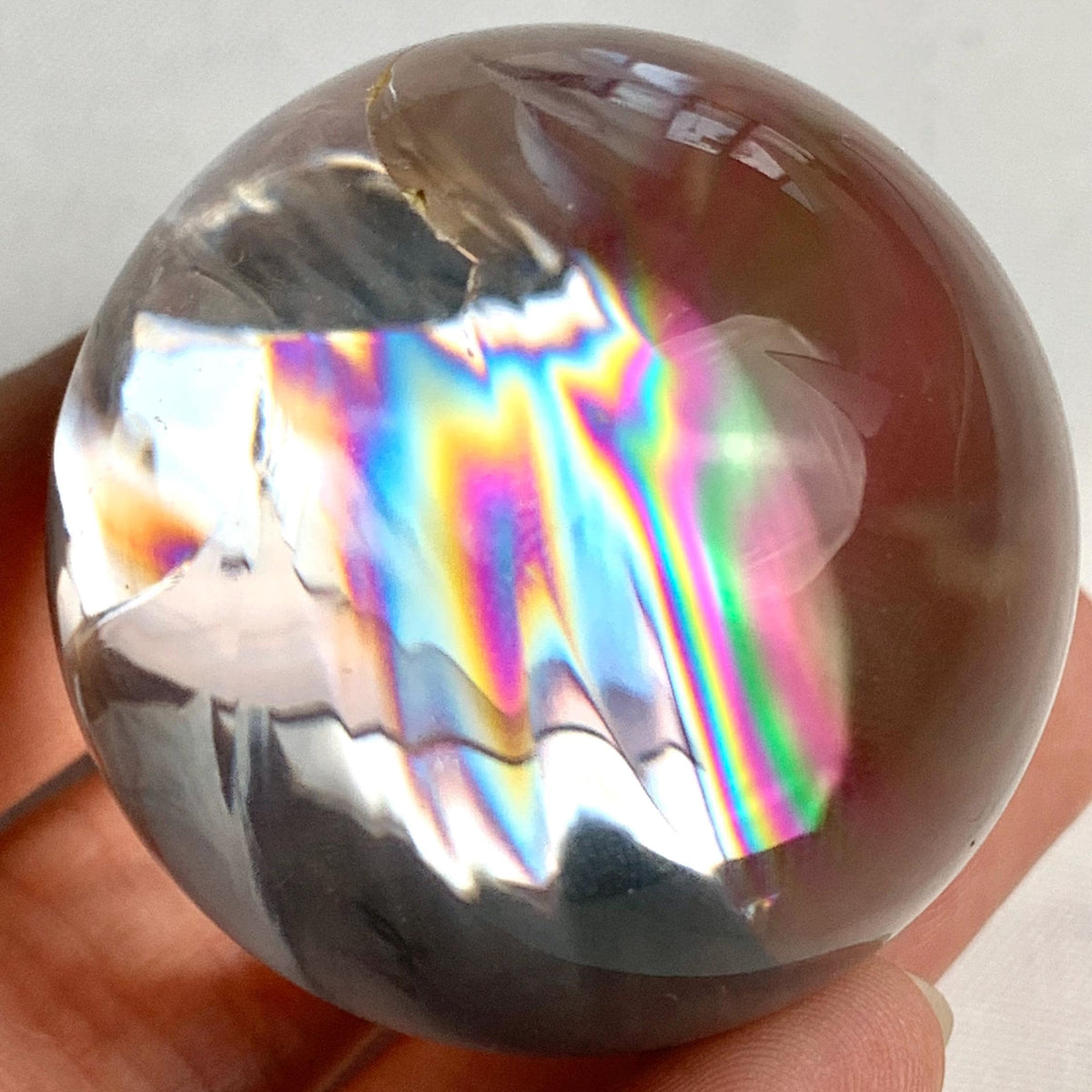 High clarity rainbow quartz ball used for meditation, crystal healing, and décor display
