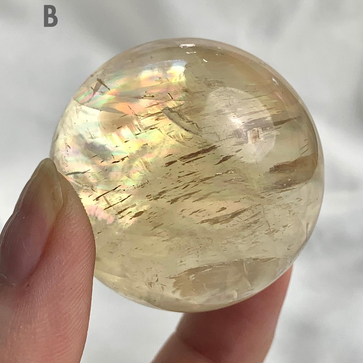 Healing crystal honey calcite sphere display