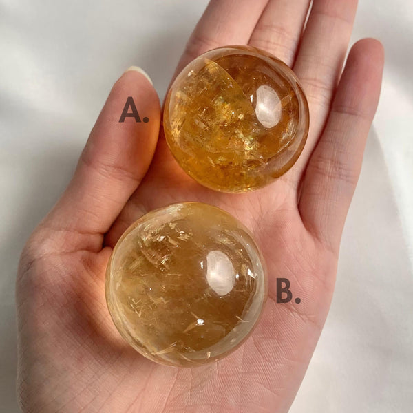 Polished honey calcite crystal sphere