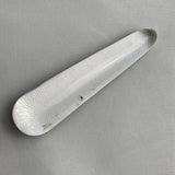 polished acupressure tool made of clear quartz