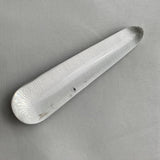 polished acupressure tool made of clear quartz